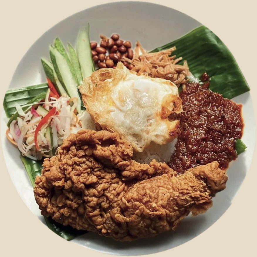 Seloka nasi lemak with crispy chicken, sambal, egg and acar